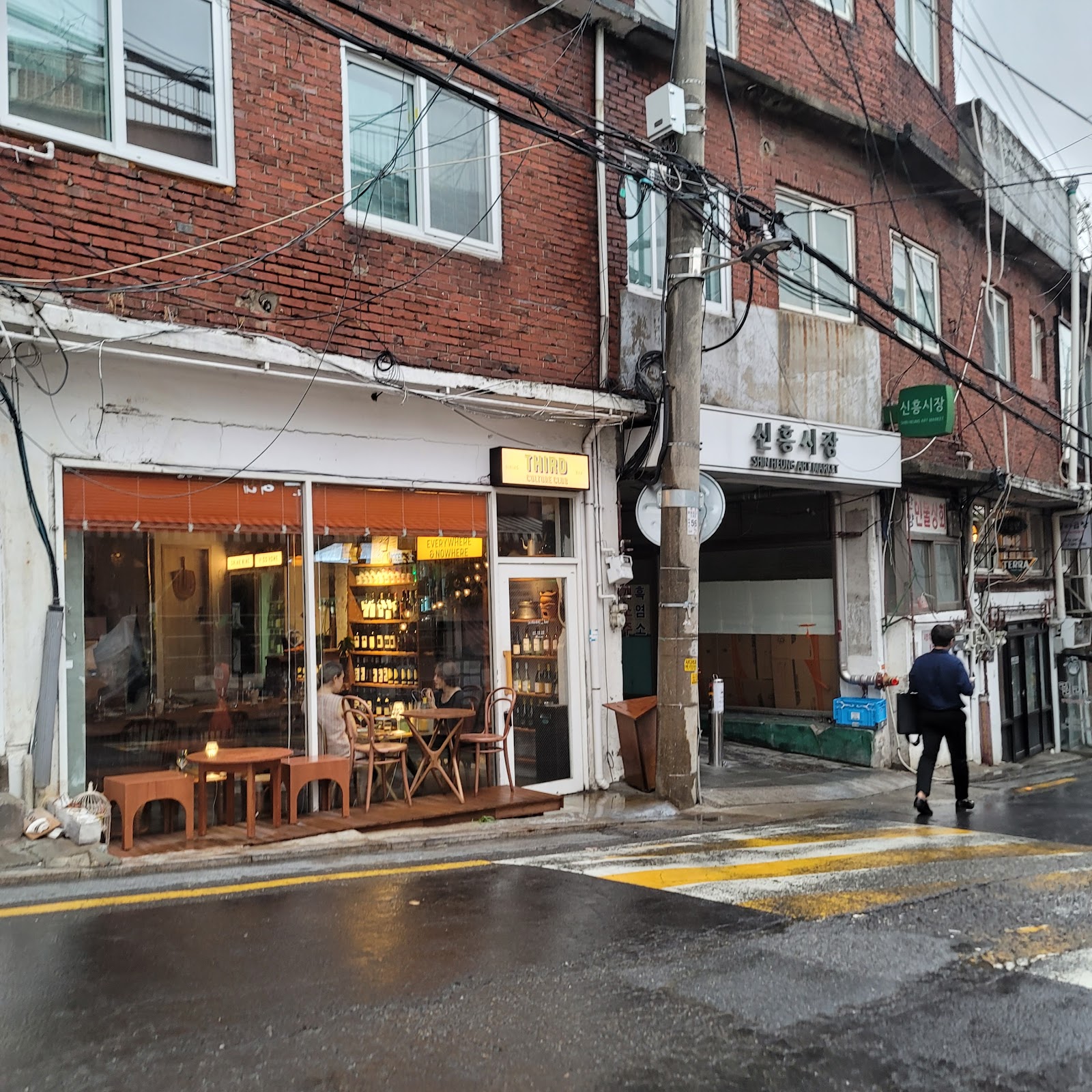 Haebangchon's hillside market alley where old stalls and modern cafes share the same lane