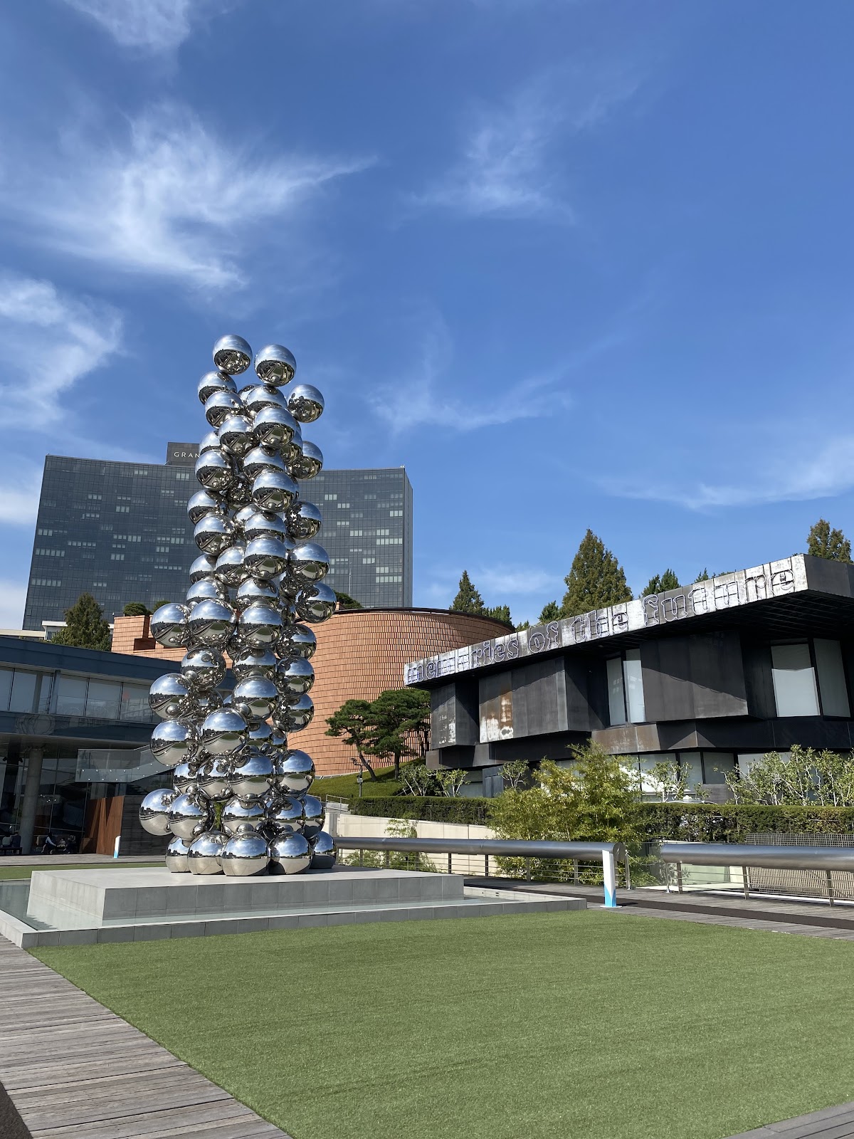 Leeum Museum — the exterior campus with Anish Kapoor's polished sphere sculpture and Mario Botta's brick cylinder