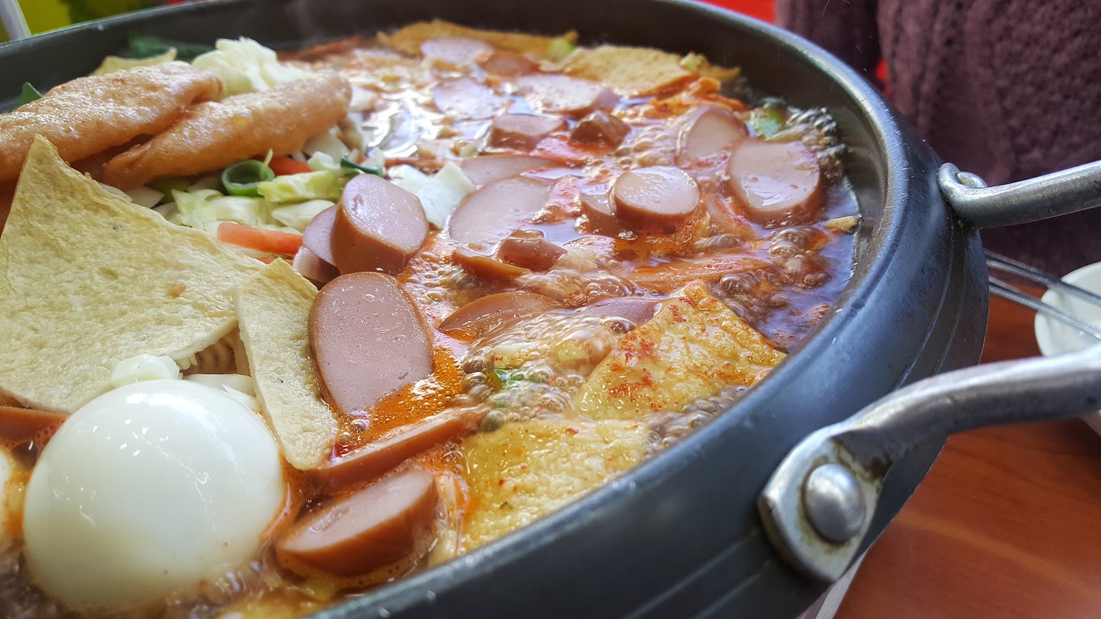 Sindang-dong tteokbokki hotpot bubbling at the table
