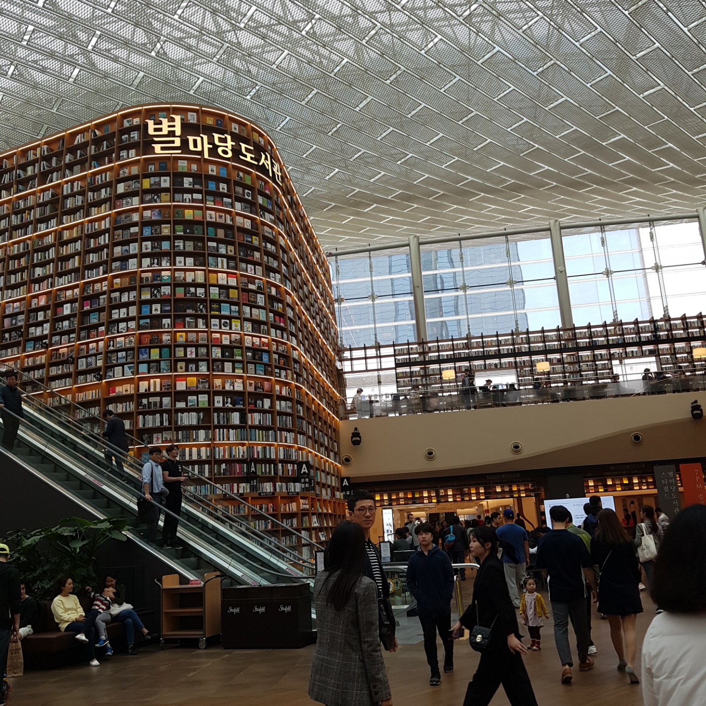 Starfield Library at COEX — 13-meter bookshelves defining walls, ceiling, and atmosphere simultaneously